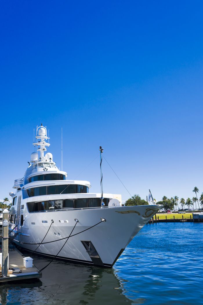 Stunning view of a luxury yacht docked in Fort Lauderdale under clear blue skies.